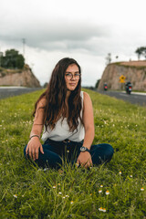 Young woman sitting on a rock in nature