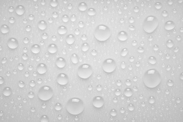 Water droplets on a gray background. Water droplets on a background of water drops.