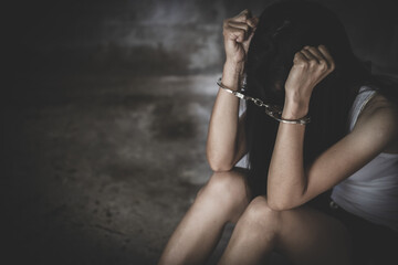 The victim was locked by handcuffs. Women violence.  Human trafficking concept.