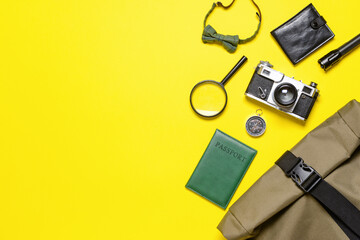 Set of travel accessories for men on color background