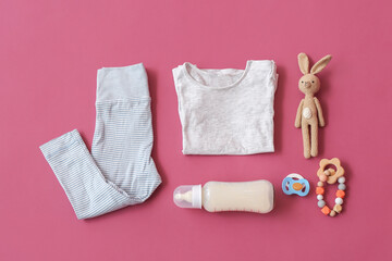 Set of baby accessories on color background