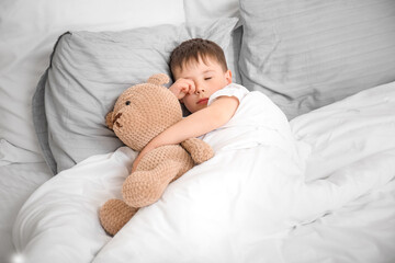 Little boy suffering from sleep disorder in bedroom