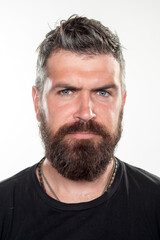Fototapeta premium Hipster guy models in studio. Bearded man with long beard and moustache in barbershop.