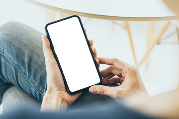 cell phone mockup blank white screen.woman hand holding texting using mobile on desk at coffee shop.background empty space for advertise.work people contact marketing business,technology