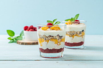 homemade mango and raspberry with yogurt and granola