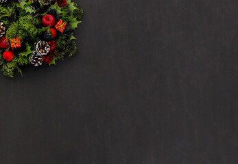 New year background christmas wreath on dark chalk board.