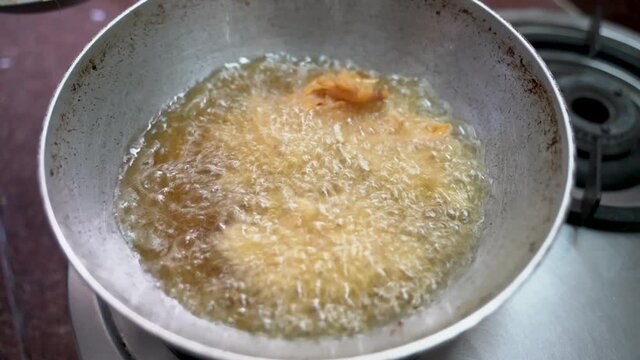 Mixed Onion Pakoda Recipe Deep Fried On A Frying Pan With Boiling Cooking Oil. - Close Up Shot