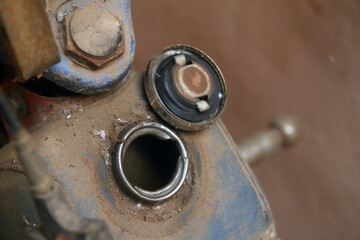 Old open fuel tank door on a motorcycle