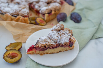 sweet home made plum crumble pie on a table