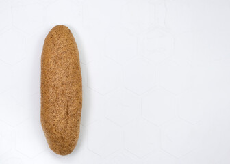 Long french baguette made from white flour, cools after baking isolated on white background.