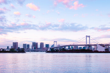 Fototapeta na wymiar Odaiba Rainbow bridge with Tokyo bay view at evening sunset sky