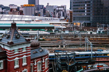 Tokyo Station red brick building with many train and Shinkansen track from aerial view