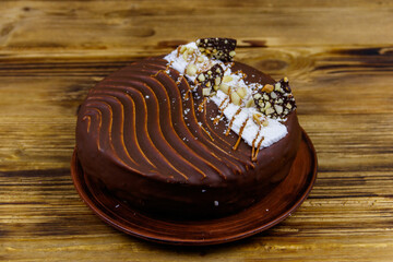 Tasty chocolate cake on a wooden table