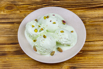 Pistachio ice cream on wooden table
