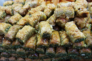 Oriental sweets on the counter. Handmade Oriental sweets at the market in Jerusalem. Market, SHUK Mahane Yehuda with fresh baklava counter in Jerusalem, Israel