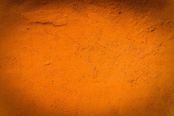 Orange concrete wall texture and background