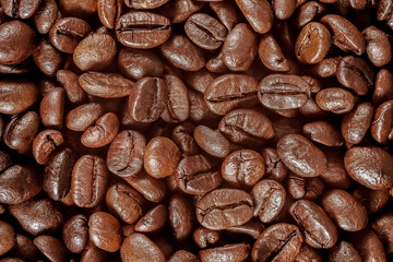 Close up roasted coffee beans top view or Coffee beans background