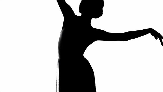 Silhouette of dancing ballerina isolated on white 