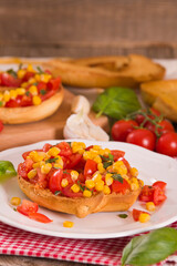 Friselle with tomatoes and mais.	