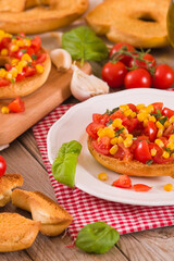 Friselle with tomatoes and mais.	