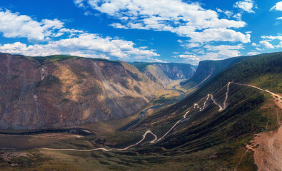 Panorama of the Katu Yaryk mountain pass and the valley of the river of Chulyshman. Altai Republic, Russia, beautiful summer day