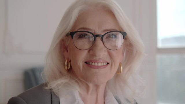 Business adult woman 60-70 years old with glasses at office