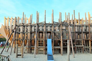 Children's playground in the form of an island of an old wooden ship
