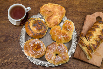 fresh tasty homemade buns with cup of coffee