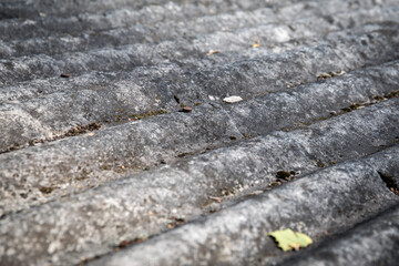 Asbestos slate. Roofs of houses and farm buildings. Environmentally unfriendly and harmful to human health