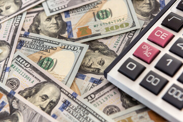 save money calculator and dollar bills