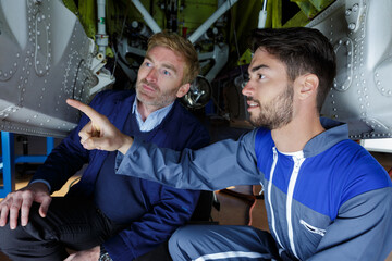 young engineer pointing at something