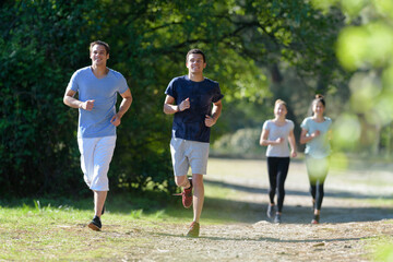 young people running in nature