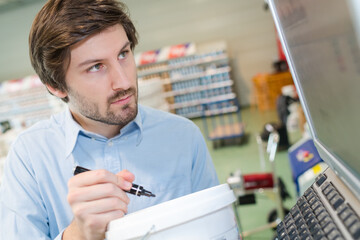 man checking code in computer