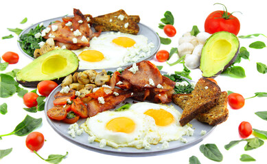 Fried eggs and bacon with a serve of spinach mushrooms and toast