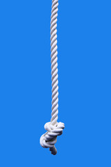 Sports rope isolated on a blue background. Close-up.