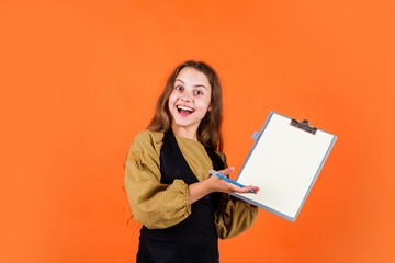 Happy child show folder. childhood development. smart kid model holding school folder. making notes. teen girl ready to work. writing and reading info. student concept. back to school. copy space