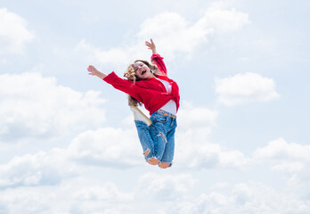 kid jump outdoor. kid fashion and beauty. sense of freedom. portrait of energetic child girl. concept of future. happy childhood. cheerful teen girl jumping high