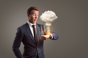 Shocked businessman with an exploding watch