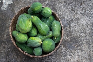 Raw Papaya or Pawpaw in a Bamboo Busket