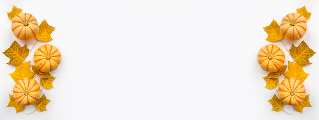 Thanksgiving holiday objects for mock up template design. Autumn pumpkin and fall leaves. View from above. Flat lay, top view, overhead, copy space