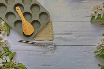 Kitchen utensils for baking including cupcake silicon mold, whisk and wooden spoon