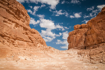 Desert landscape with blue sky and sun