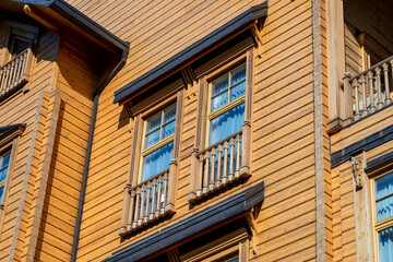 Ukrainian traditional rural wooden house, background exterior facade with windows frame. Kyiv, Ukraine