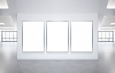 Three vertical frames Mockup hanging on office wall. Mock up of a billboards in modern company interior - obrazy, fototapety, plakaty