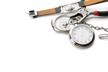 Watches and tools for repair on white background