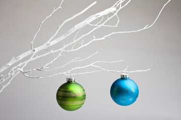 christmas ornament hanging on white branch