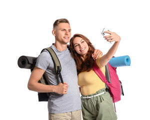 Fototapeta na wymiar Couple of tourists taking selfie on white background