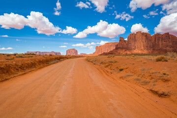 Fototapeta na wymiar Road and red rocks in Monument Valley. Navajo Tribal Park landscape, Utah/Arizona, USA