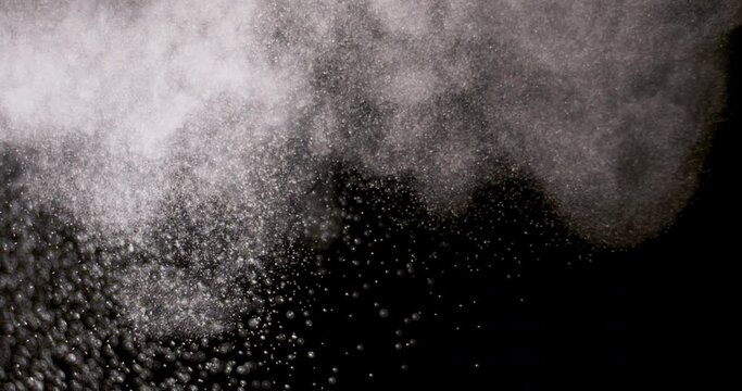 White dust powder isolated on black background