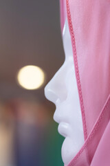 Close-up female Muslim mannequin in hijab.